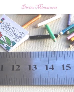 childs coloring book and pencils in 1:12 scale dollhouse miniature