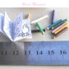 childs coloring book and pencils in 1:12 scale dollhouse miniature