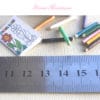 childs coloring book and pencils in 1:12 scale dollhouse miniature