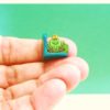 green frog on a lilypad bookend in 1:12 scale dollhouse miniature