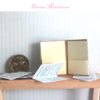 sheet music folder with music in 1:12 scale dollhouse miniature